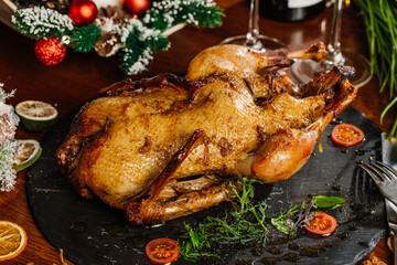 Christmas dinner with duck and apples, festive table setting, New Year.