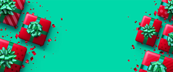 Christmas red gift boxes on green background.