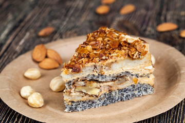 sweet cake with buttercream and sponge cake and lots of poppy seeds and nuts