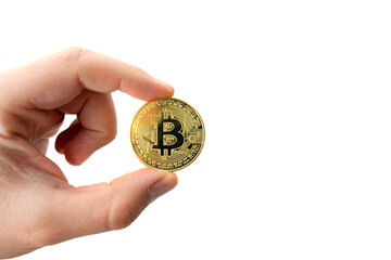 Fototapeta na wymiar Diyarbakir, Turkey - September 25, 2021: Close up shot of a golden Bitcoin coins on hand holding bitcoin coin image with white background