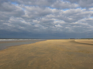 Fototapeta na wymiar cloudy sky on the beach of IJmuiden in the Netherlands