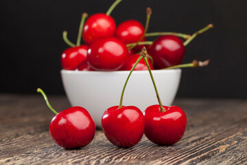 red ripe sweet cherries on a wooden table