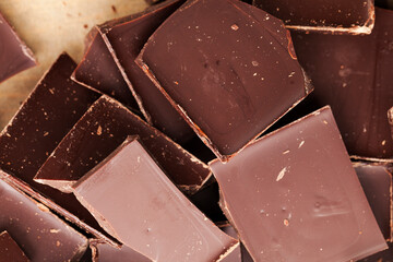 a chocolate bar broken into more pieces