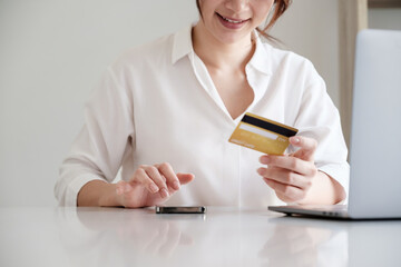 Woman using online banking to paying credit card bill. online payment concept.