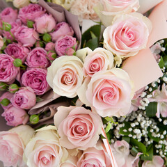 Pink roses for love background. Beautiful bouquet of flowers, top view.