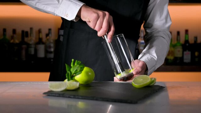 Barman preparing mojito cocktail. High quality 4k footage