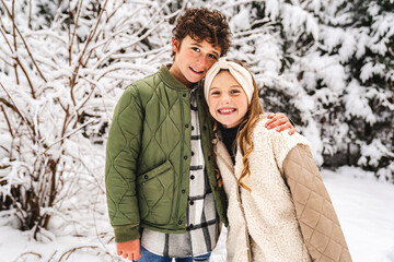 Nice brother and sister Children having fun in winter season
