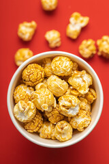 Sweet caramel popcorn in cup.
