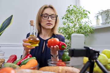 Woman nutritionist recording a video about healthy food, nutrition