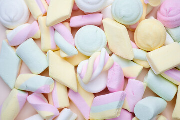 many pastel colored marshmallows as background photo with copy space