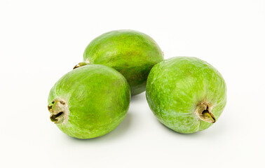 Three feijoa on white background