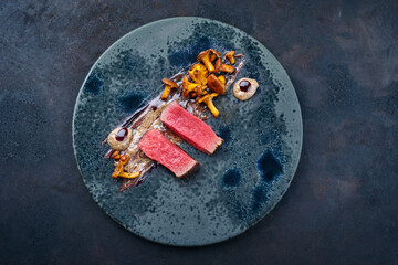 Modern style traditional fried dry aged angus beef tenderloin steak natural with chanterelle mousse...