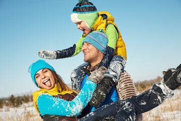 happy playing family in the winter. people outdoors - 472500603