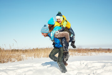 happy playing family in the winter. people outdoors - 472500607