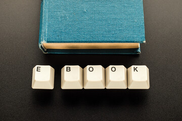 Book and also keyboard keys made up the word e book.