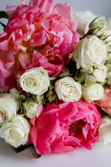 Large peonies and small white roses