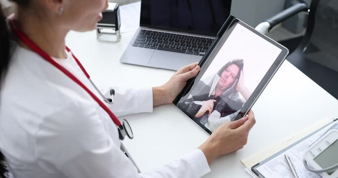 Doctor Remotely Consults Sick Patient Via Video Call