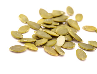 Hulled pumpkin seeds isolated on white background
