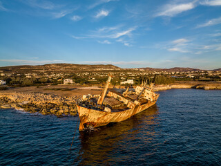 Cyprus - Abandoned shipwreck EDRO III in Pegeia, Paphos, Cyprus from drone view at amazing sunset time