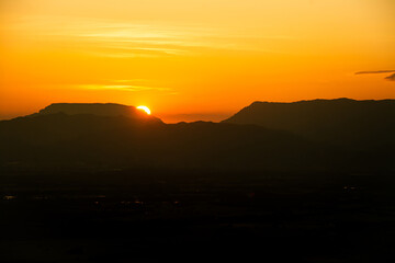 The sun was setting on the edge of the ridge Mountain. sunset