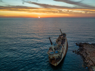 Obraz premium Cyprus - Abandoned shipwreck EDRO III in Pegeia, Paphos, Cyprus from drone view at amazing sunset time