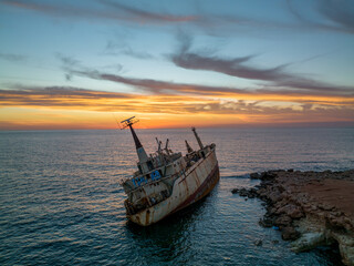 Cyprus - Abandoned shipwreck EDRO III in Pegeia, Paphos, Cyprus from drone view at amazing sunset time