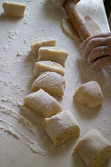 dough and flour on the table. cooking gingerbread. knead the dough to make a pie. grandmother prepares a cupcake. mom makes sweets.