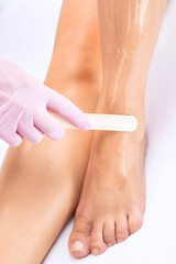 Elos epilation hair removal procedure on a woman’s body. Beautician doing laser rejuvenation in a beauty salon. Removing unwanted body hair. Hardware ipl cosmetology