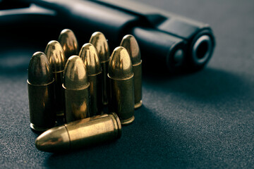 Gun, Pistol with ammunition on black  background - obrazy, fototapety, plakaty
