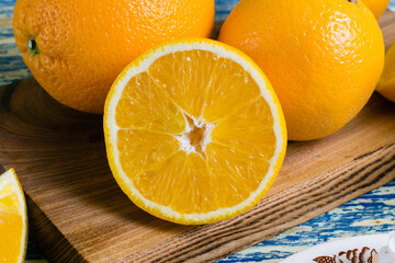 Juicy orange close-up on a cutting board. Healthy nutrition concept