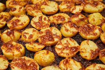 Oven baked potatoes with cheese crust