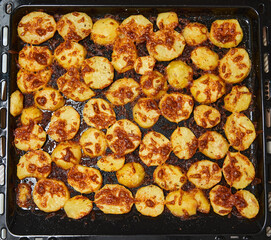 Oven baked potatoes with cheese crust