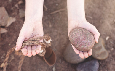 David Holding a Sling and a Stone Out Before He goes to Kill Goliath the Giant