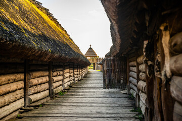 Biskupin, Poland - August 09, 2021. Archaeological site and a life-size model of a late Bronze Age...