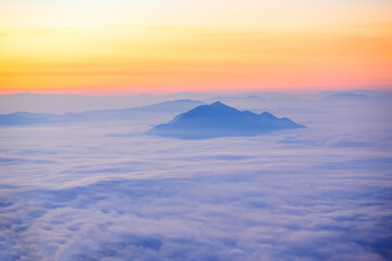 A Morning landscape with thick fog, sky and misty mountains, beautiful.