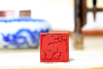 Chinese craftsman carving a stone seal