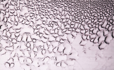 Macro background with water droplets condensation pattern on metal surface 
