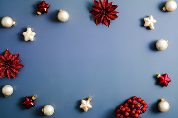 Stylish Chrsitmas decorations on blue background. Flat lay, top view, copy space. Chrsitmas card...