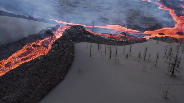 Aerial view of lava floating down the Volcan Cumbre Vieja, a volcano during eruption near El Paraiso town, Las Manchas, La Palma Island, Canary Islands, Spain.