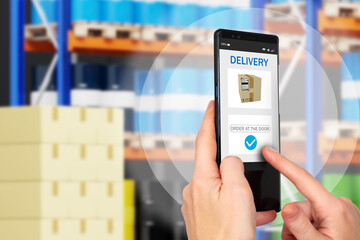 Delivery business. Sending order by courier delivery. Human hands on background of blurred warehouse. Concept - ordering from online store. Sending order to buyer's door. Apps delivery service