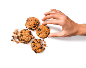 Female hand with tasty chocolate chips cookies on white background