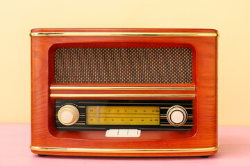 Fototapeta premium Vintage radio receiver on color background