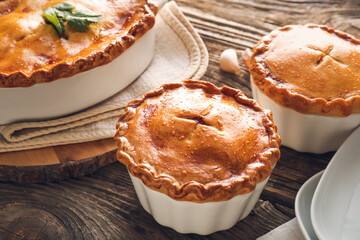 Tasty beef pot pies on table