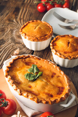 Tasty beef pot pies on table