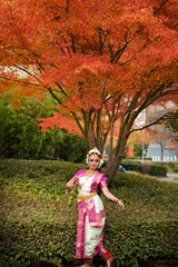 Bharatanatyam dancer outdoor in fall 
