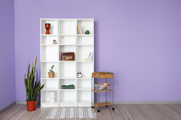 Modern shelf unit and table  in room