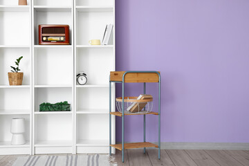 Modern shelf unit and table  in room