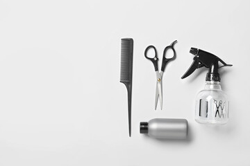 Set of hairdresser's tools on white background, top view
