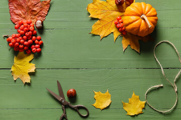 Composition with natural forest decor, pumpkin and scissors on color wooden background, closeup