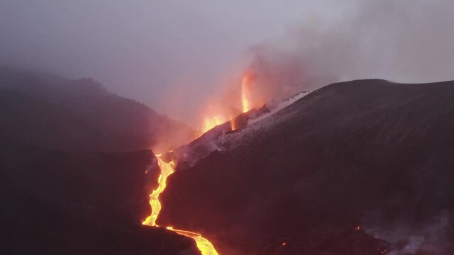 Aerial view of lava floating down the Volcan Cumbre Vieja, a volcano during eruption near El Paraiso town, Las Manchas, La Palma Island, Canary Islands, Spain.